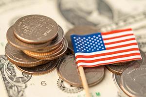 Stack of coins with USA America flag on white background. photo