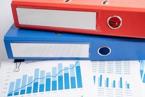 Import and Export. Binder data finance report business with graph analysis in office.
