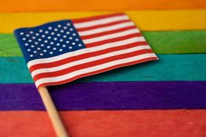 America USA flag on rainbow background symbol of LGBT gay pride month  social movement rainbow flag is a symbol of lesbian, gay, bisexual, transgender, human rights, tolerance and peace.