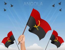 angola banderas ondeando bajo el cielo azul vector