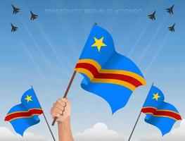 república democrática del congo banderas ondeando bajo el cielo azul vector