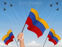 banderas de colombia ondeando bajo el cielo azul vector