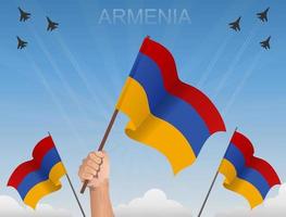 banderas de armenia volando bajo el cielo azul