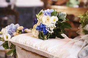 Wedding bouquet over the grooms bench