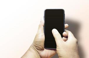 Man hand holding blank isolated smartphone background photo