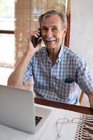 Smiling Older Man Talking On Cellphone photo