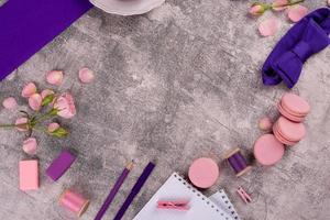 Beautiful pink tasty macaroons on a concrete background photo