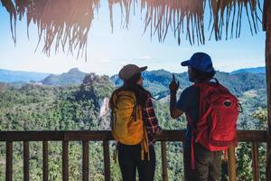 Travel, nature travel of Asian couples while is relaxing outdoors during his trip in Thailand. photo