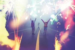 Travel nature Lover asian women and asian man Take a picture Shoot the fireworks In New Year's Mountain. Thailand photo