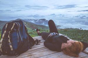 Asian women travel sleep relax. Morning atmosphere nature Forests, mountains. Phu Thap Buek Thailand photo