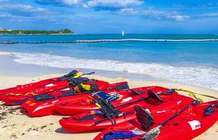 Playa del Carmen, Mexico, May 28 2021 - Red canoes at a beach
