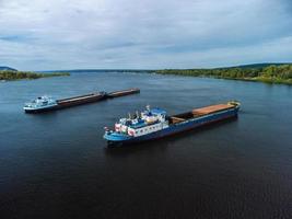 Aerial view of unloaded dry cargo ships on river. photo