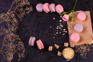 Beautiful pink tasty macaroons on a concrete background