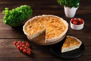 Delicious fresh quiche with broccoli, salmon and cheese photo