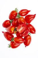 Fresh ripe organic tomatoes on white background. Studio Photo. photo