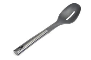 Plastic culinary black spoon, slotted spatula, kitchen gadget. Kitchen utensil. Isolated photo