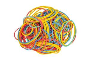 Many colourful multi coloured elastic rubber bands on white background. photo