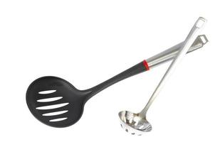 Kitchen utensils spoon with slots, slotted spoon isolated on white background. Studio Photo