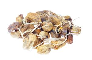 Pile of dried figs on rope isolated on white background. Studio Photo