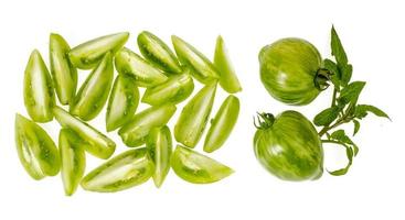 Slices of green fresh chopped tomatoes isolated on white background photo