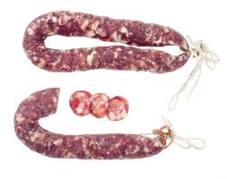 Homemade pork dried cured sausage on white background photo