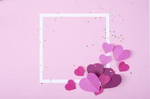 Abstract Background with Paper Hearts and Empty White Frame for Valentine s Day. Pink Love and Feeling Background for poster, banner, post, card photo