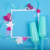 Abstract Background with Paper Hearts, frame, blue champagne glasses for Valentine s Day. Pink Love and Feeling Background for poster, banner, post, card. Top view photo