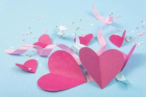 Abstract Background with Paper Hearts, ribbons for Valentine s Day. Blue Love and Feeling Background for poster, banner, post, card photo