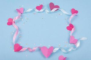 Abstract Background with Paper Hearts, ribbons for Valentine s Day. Blue Love and Feeling Background for poster, banner, post, card. photo