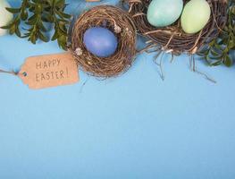Colorful background with Easter eggs on blue background. Happy Easter concept. Can be used as poster, background, holiday card photo