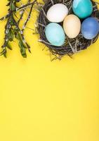 Colorful background with Easter eggs on yellow background. Happy Easter concept. Can be used as poster, background, holiday card photo