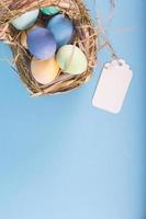 Colorful background with Easter eggs on blue background. Happy Easter concept. Can be used as poster, background, holiday card. photo