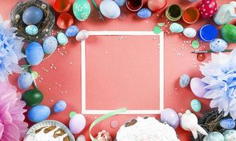 Colorful background with Easter eggs on red background. Happy Easter concept. Can be used as poster, background, holiday card. Flat lay, top view, copy space. Studio Photo