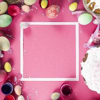 Colorful background with Easter eggs on pink background. Happy Easter concept. Can be used as poster, background, holiday card. Flat lay, top view, copy space. Studio Photo