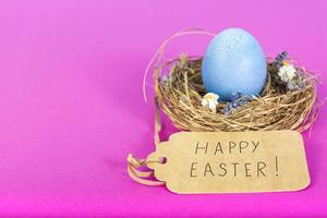 Colorful background with Easter eggs on pink background. Happy Easter concept. Can be used as poster, background, holiday card. Flat lay, top view, copy space. Studio Photo