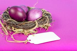 Colorful background with Easter eggs on pink background. Happy Easter concept. Can be used as poster, background, holiday card. Flat lay, top view, copy space. Studio Photo