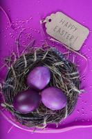 Colorful background with Easter eggs on lavender background. Happy Easter concept. Can be used as poster, background, holiday card. Studio Photo