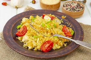 Healthy food. Couscous with chicken and vegetables. Studio Photo