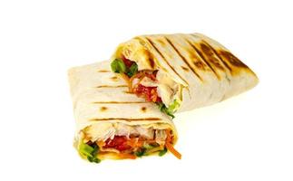 Homemade lavash, shawarma with vegetables, chicken. Studio Photo