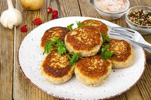 Homemade meat cutlets on wooden table. Studio Photo