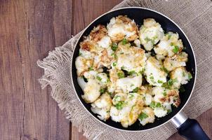 Cauliflower in batter, fried in pan. Studio Photo