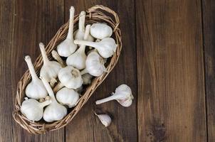 Wicker basket with fresh organic farming garlic photo