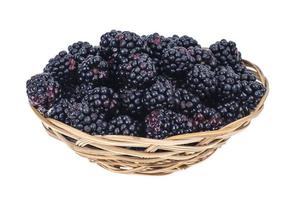 Ripe sweet black blackberries in wooden bowl photo