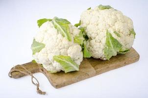 Fresh head of cauliflower on white background photo