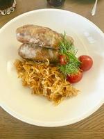 Bavarian sausages with stewed cabbage. Studio Photo