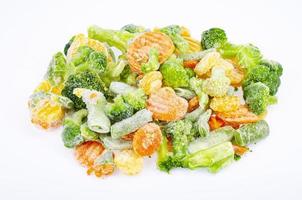 Pile of frozen raw vegetable pieces isolated on white background. Studio Photo. photo