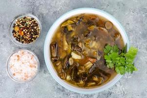 Delicious hot soup with wild mushrooms. Studio Photo. photo