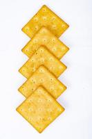 Delicious salty golden biscuit cracker square shape. Studio Photo. photo