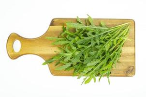 Fresh green farm arugula leaves for cooking use. Studio Photo