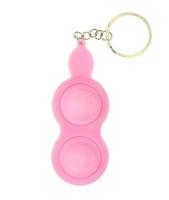 Pink keychain for two simple dimples, pop it. Fashionable and modern anti stress toy for children and adults photo